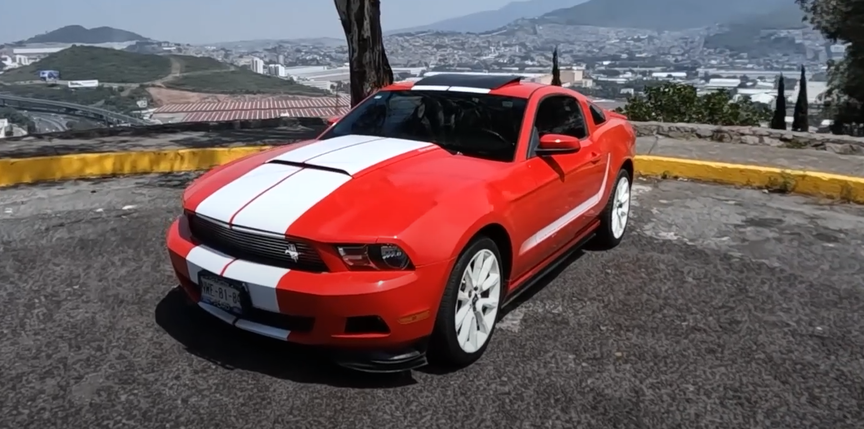 Three-quarter front view of a red 2012 Ford Mustang ST